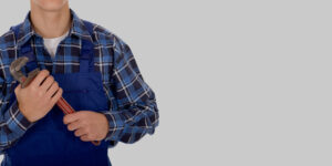 Image of a plumber holding a wrench