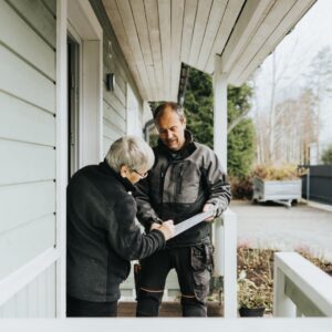 An electrical contractor talking with a customer