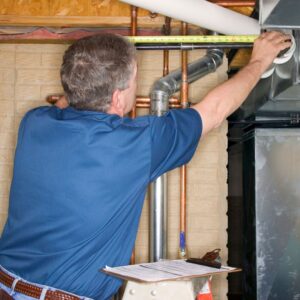 An inspector looking at plumbing