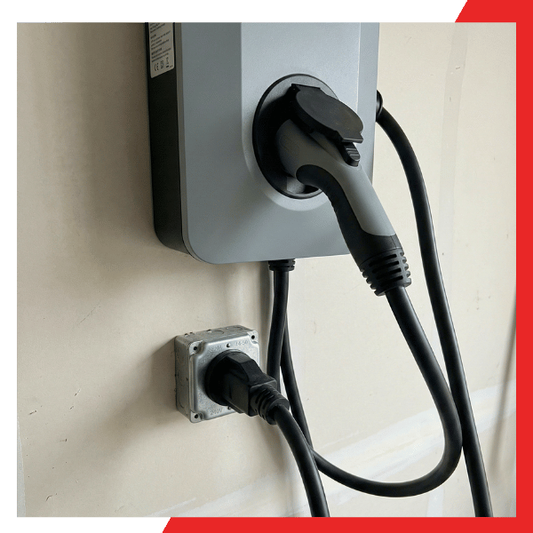 Level 2 EV fast charging station at home plugged into a heavy-duty NEMA 14-50 240V outlet.