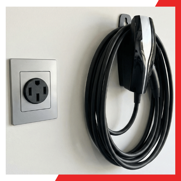 Industrial-grade 240V outlet for electric car with a Tesla mobile connector neatly mounted on a Marin County garage wall.