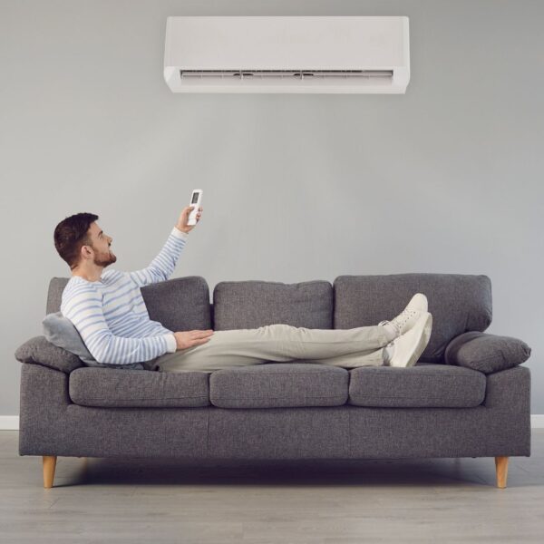 Person turning on their home AC unit.