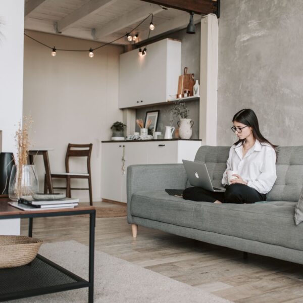 Woman sitting comfortable in her smart home.