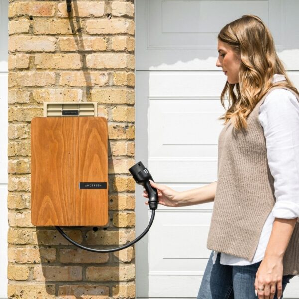 Homeowner using a residential EV charging station.